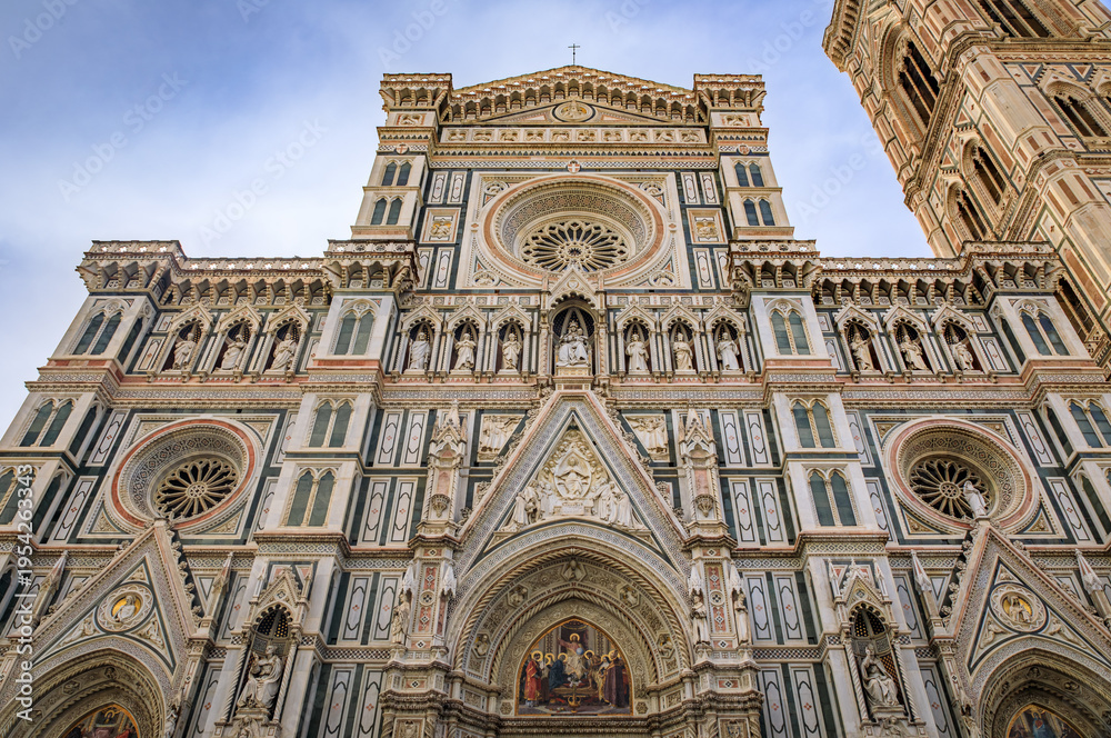 Fototapeta premium Ornate marble facade of the famous Duomo Cathedral in Florence, Italy
