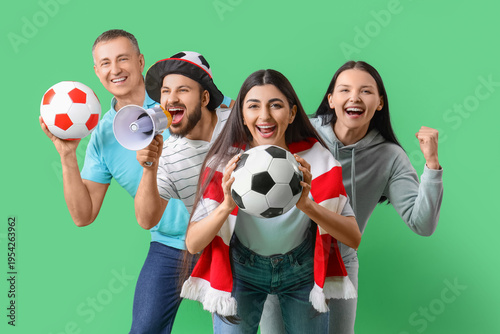 Soccer fans with balls and ...