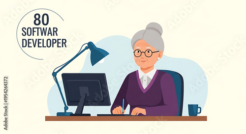 A senior software developer working at her desk with a computer and lamp