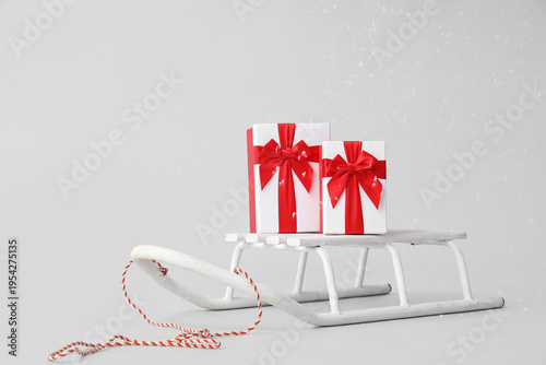 Sled with gift boxes and fa...