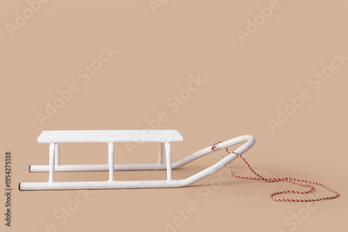 White empty sled on beige b...