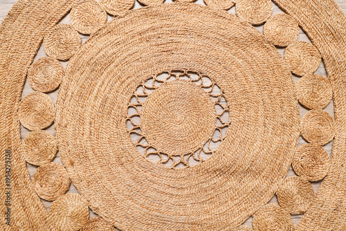 Wicker carpet on wooden flo...