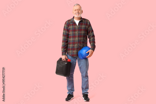 Mature man with canister an...
