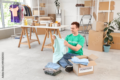 Male volunteer donating clo...