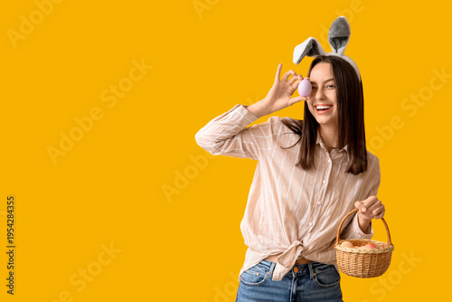 Pretty young woman with bun...