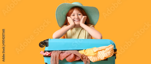 Cute girl with suitcase on ...