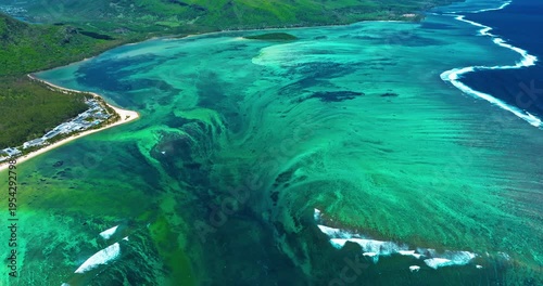 Aerial view of Underwater waterfall in a coral reef with turquoise water. Island Mauritius in the Indian Ocean