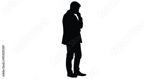 Silhouette of a man in a suit thoughtfully posing with hand to chin