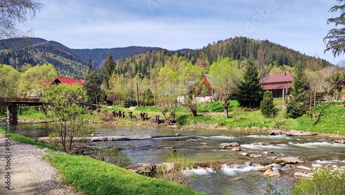 Scenic mountain village and river valley in spring, countryside travel destination