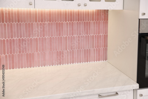 Stylish kitchen with countertop, peel and stick tiles. Interior design