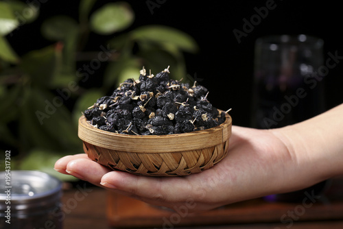 Black Goji Berries from Qinghai in Traditional Basket - Healthy Superfood Still Life Photography