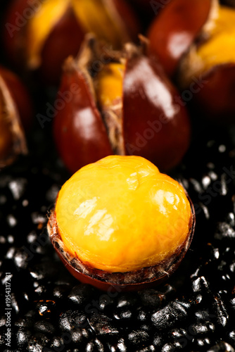 Fresh Roasted Chestnut with Golden Flesh on Coffee Beans - Studio Food Photography