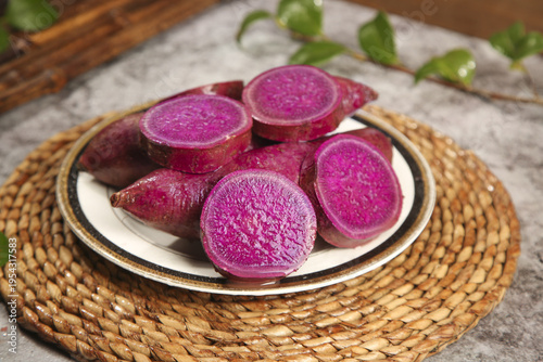 Purple Vietnamese Sweet Potatoes Sliced on Plate - Fresh Organic Root Vegetables Food Photography