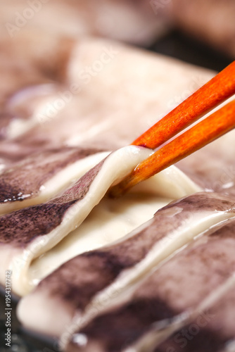 Fresh Squid Tentacles with Chopsticks - Raw Seafood Preparation Studio Photography
