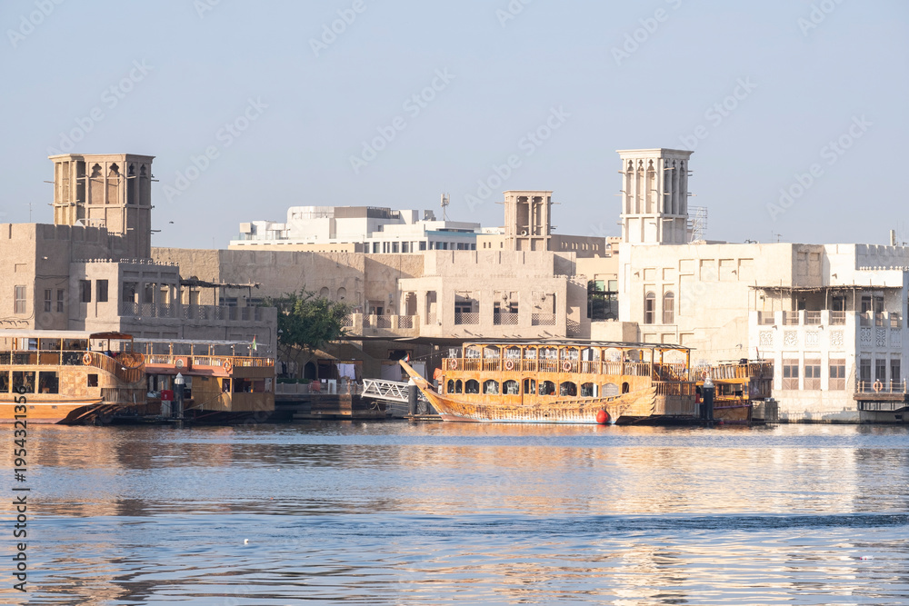 Obraz premium 12,12,2025 Dubai, UAE. A stunning wide shot of the Dubai Creek waterway in the historic Deira district