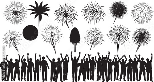 Silhouettes of people celebrating with fireworks in the background