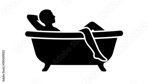 A black silhouette of a person relaxing in a bathtub