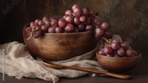 Fresh Red Grapes in Wooden Bowls with Soft Fabric on a Dark Rustic Background
