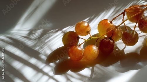 Fresh Golden Grapes with Soft Shadows and Delicate Light on Smooth Surface Capturing Nature's Beauty and Elegance in a Minimalist Setting