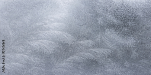 Abstract intricate ice crystals and frost patterns that have formed on a glass surface, creating a stunning display of natural beauty.