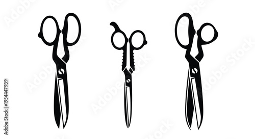 Three pairs of vintage scissors displayed in a stark black silhouette