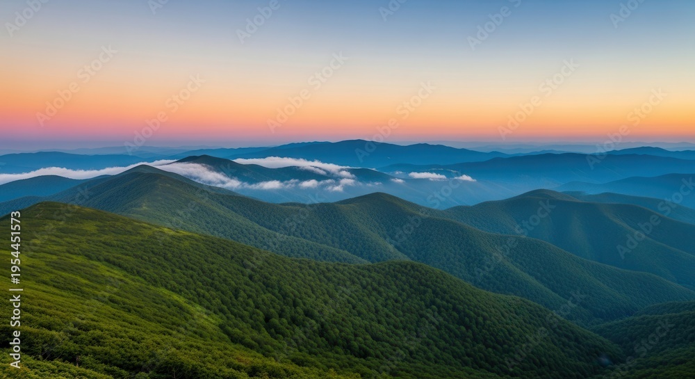 Fototapeta premium Serene mountain landscape with lush greenery and foggy hills at sunrise