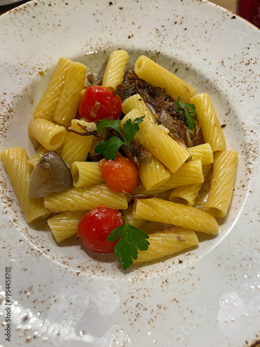 Rotini pasta with meat, mushrooms and tomatoes