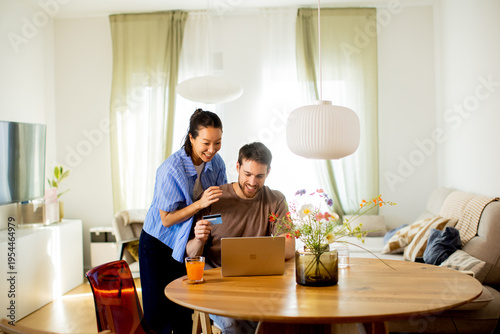 Couple enjoys online shoppi...