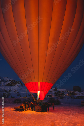 Bild auf Leinwand Flame inflating hot air balloon before sunrise flight in Cappadocia