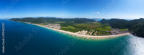 Aerial panorama of the Brazilian coast. South of the island of Santa Catarina with the views of the beaches of Acores and Pantano do Sul. Florianopolis, Brazil