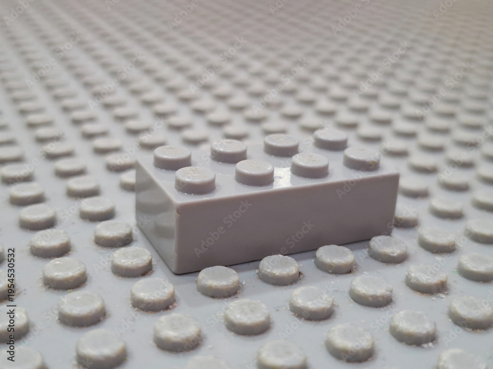 Obraz premium Single Lego Plastic Building Brick Toy Attached to Lego Baseplate Studded Surface for Creative Construction and Educational Play Development Hobby on December 19, 2025 in Bangkok, Thailand 