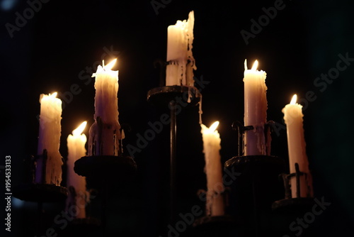 Canvastavla Candles burning in a traditional metal candlestick holder, inside a church at ni