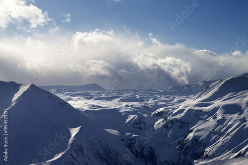 Snow plateau in evening and sunlight clouds