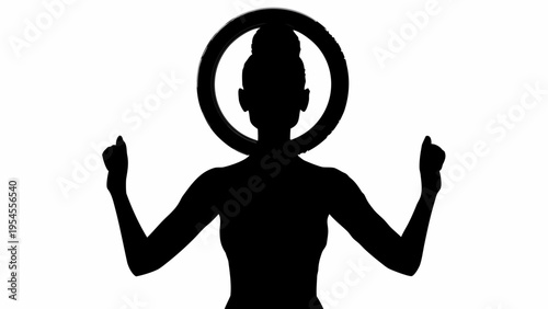 Black silhouette of a woman with hands raised and a circular halo around her head in a meditative or celebratory pose