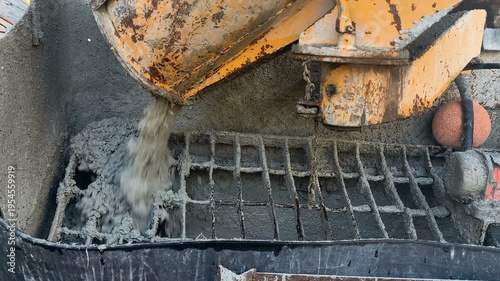 Cement concrete mixer truck kneading construction cement during house building process, 4k