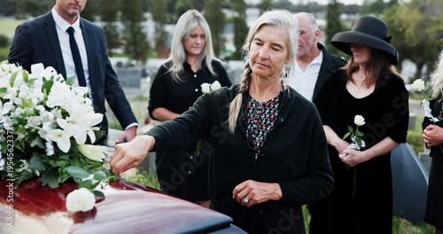Fotografie Woman funeral and rose with offering on coffin for grief or mourning death together in graveyard