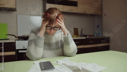Stressed Woman Calculating Expenses at Home Kitchen Table, have fun and enjoy