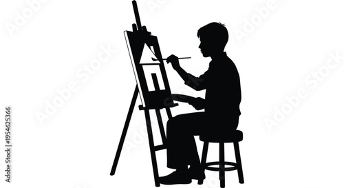 Young artist painting at an easel a striking black silhouette