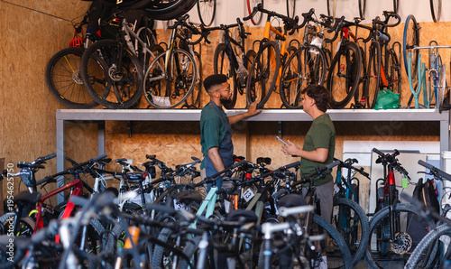 People managing bicycle inventory in sustainable store