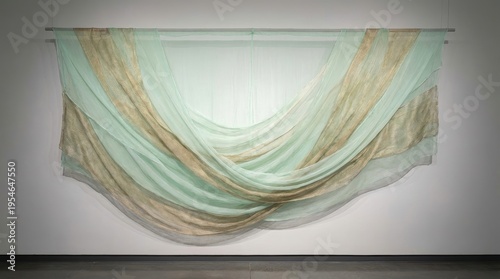 Elegant Drapery of Soft Green and Gold Textiles Flowing Gracefully in a Contemporary Interior Setting