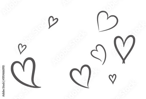Scattered hand drawn dark grey hearts a white love romance symbol