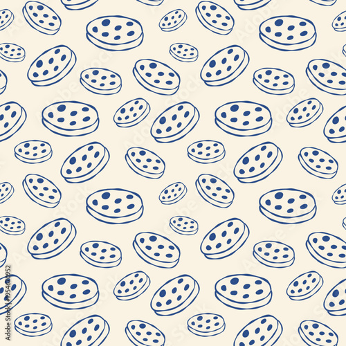 Hand-drawn pattern of blue cookies on cream background. Cookies scattered with dots and varying sizes. Perfect for food packaging, dessert menus, or bakery designs