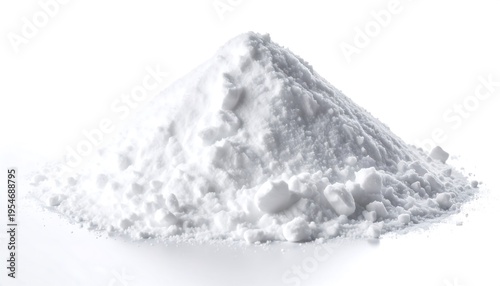 Close-up of a white, granular substance piled against a white backdrop, casting slight shadows and showing textures