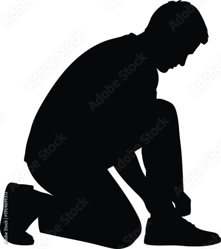 Man kneeling tying shoelaces silhouette with getting ready