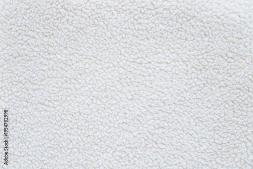 white fluffy sherpa fleece fabric texture background with soft wool material for winter clothing blankets or textile cozy mockup