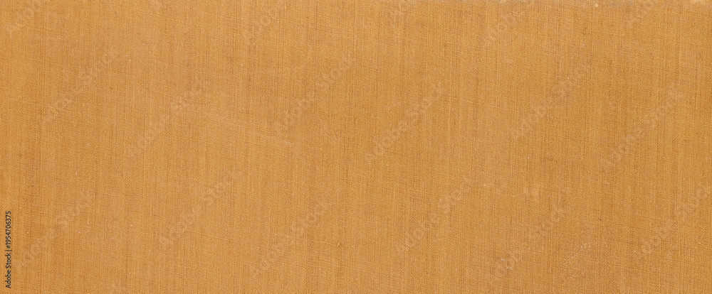 Fototapeta premium Close up of yellow ochre fabric texture background with detailed weave pattern for fashion design upholstery or textile industry projects