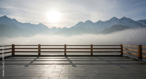 Scenic mountain terrace overlooking a misty valley at sunrise