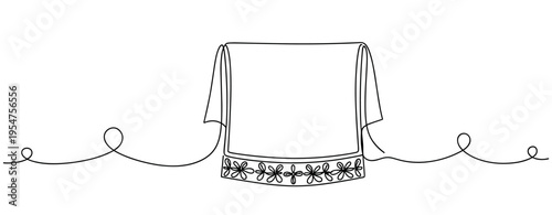 Folded towel draped over line with floral trim detail. no editable strokes
