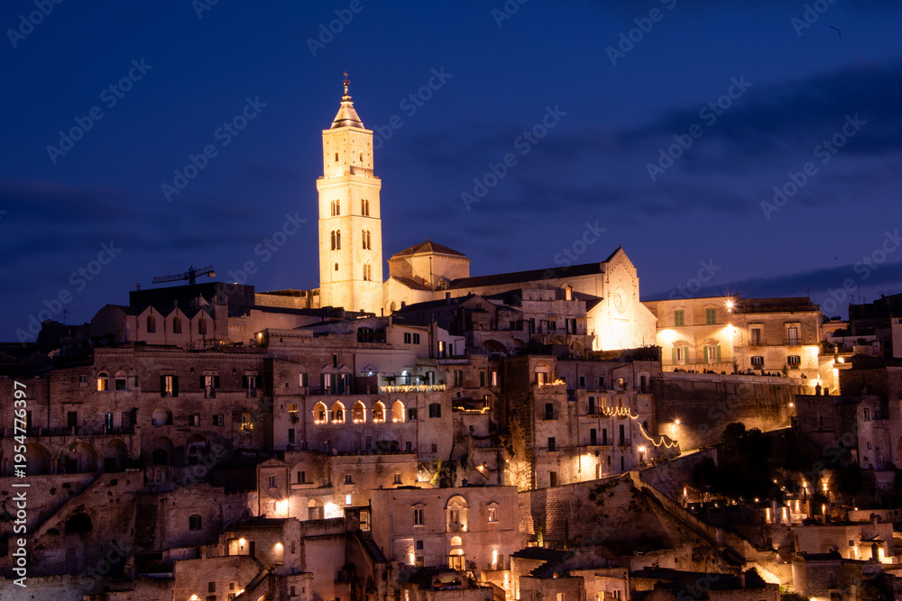 Fototapeta premium The Cathedral of Matera rises above the Sassi, a Romanesque crown of stone watching over centuries of history.