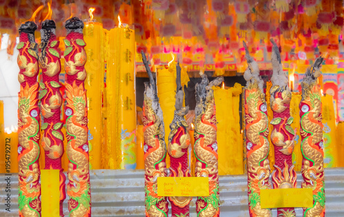 Wallpaper Mural A brightly colored candle in a Chinese Buddhist temple in Bangkok, Thailand. Torontodigital.ca